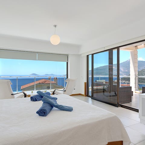 Wake up to sunlight streaming in through floor-to-ceiling windows and that view