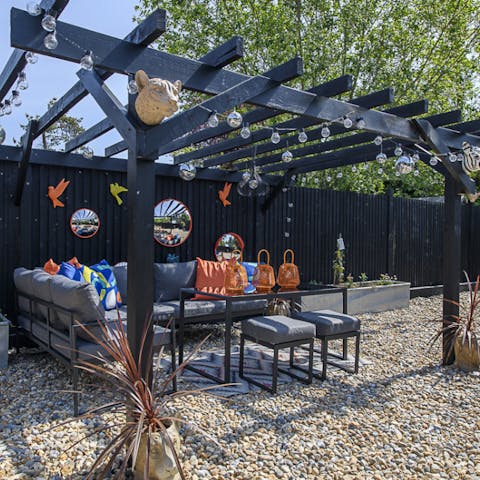 Sit out in the garden lounge area and enjoy the sun with an evening drink