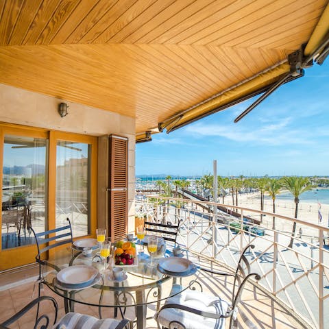 Enjoy cocktails on the balcony overlooking the sea