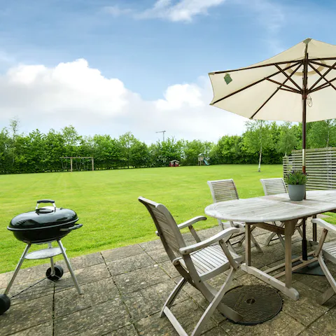 Fire up the barbecue on the private patio, whilst the kids let off some steam in the shared paddock