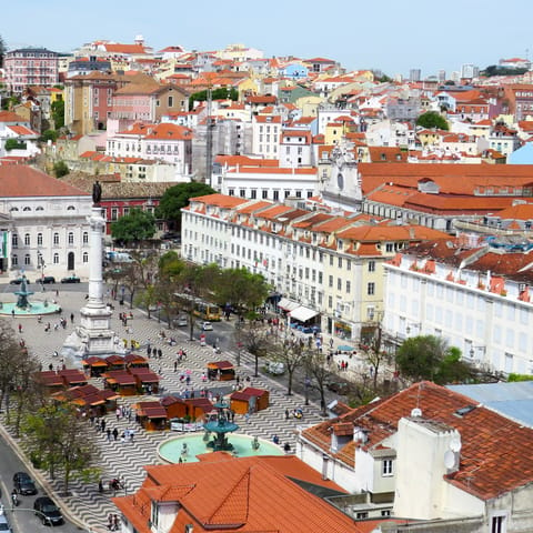 Find a sunny spot for a drink in Rossio Square  –⁠ just eight minutes away on foot