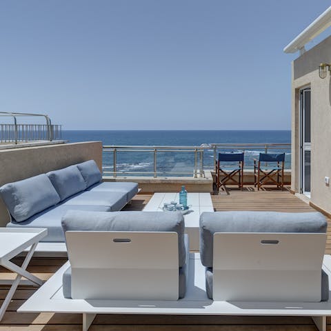 Lounge about on your deck and watch the waves roll in