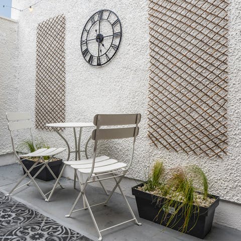 Sit out with a glass of fizz in the seating area on your private patio