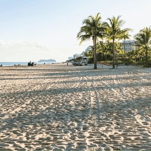 Stay just a seven-minute drive away from the sandy shoreline of Las Olas Beach