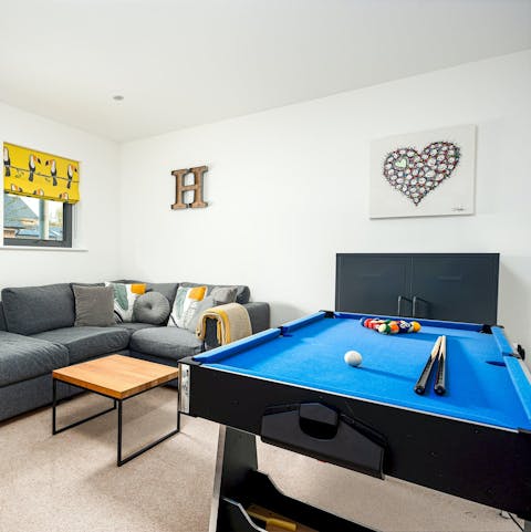 Have some fun playing pool in the home's game room