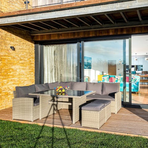 Gather for an alfresco barbecue on the shaded deck