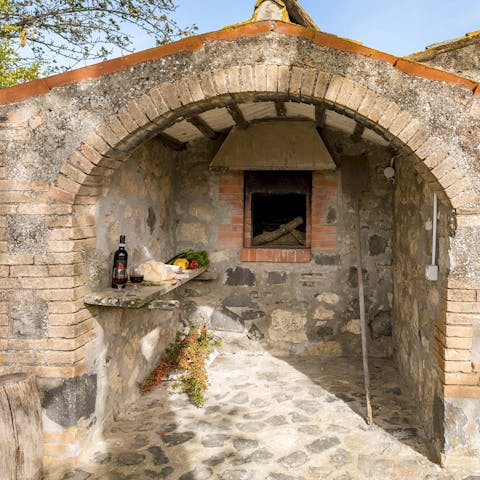 Cook rustic-style in the covered barbecue area in the little stone building