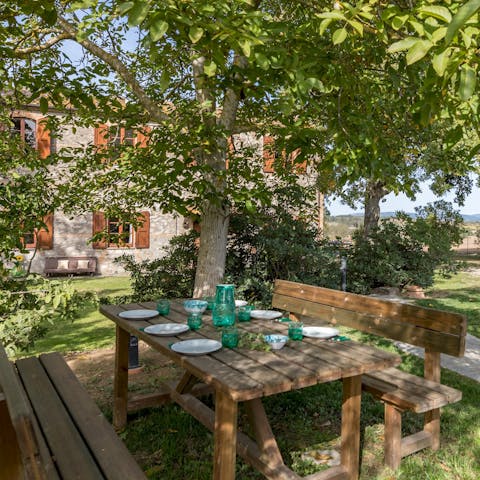 Find a spot shaded by trees in the garden for an alfresco lunch