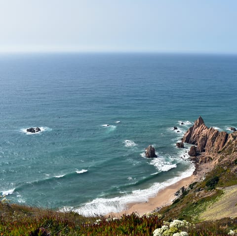 Stay in charming Aroeira and explore its dramatic beaches and cliffs