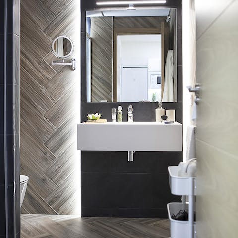 Pamper yourself in the beautiful wood-panelled bathroom 