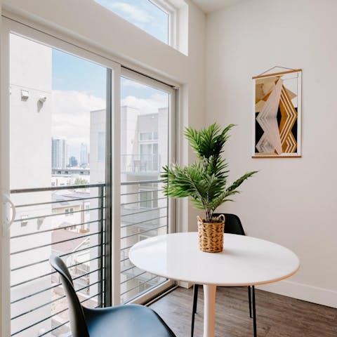 Sit down to a meal at the window-side table while feasting on Denver skyline views