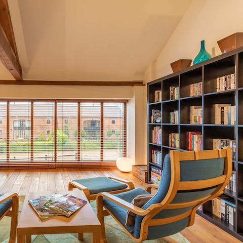 Choose a book from the library, put your feet up and relax in the armchair