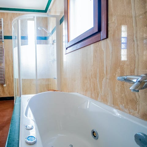 Treat yourself to a long soak in the Jacuzzi bathtub