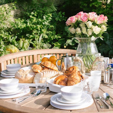 Start your morning with a breakfast of fresh pastries in the landscaped garden
