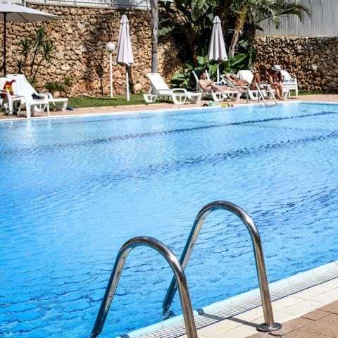Take an afternoon dip in the communal swimming pool when you need a break from the ocean waves 