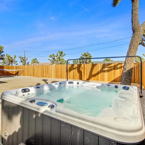 Soak in the hot tub looking out to the Joshua Tree tops