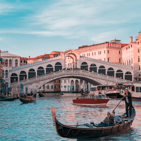 Head to Rialto Bridge and discover the beauty of Venice, just a ten-minute walk away