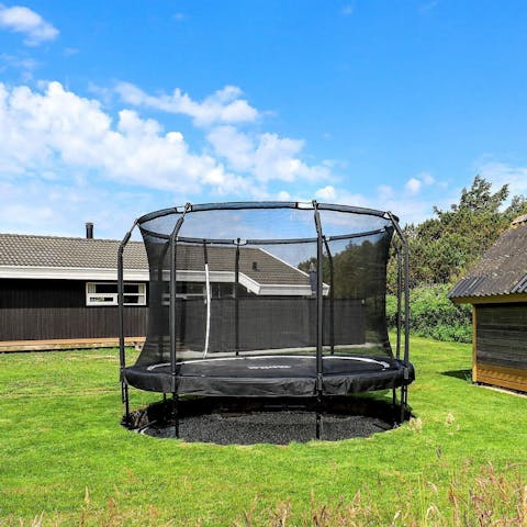 Keep the kids busy on the trampoline, fitted with a safety knit