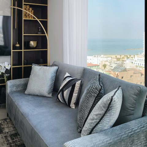 Curl up in the high-style living spaces and soak up the sea views