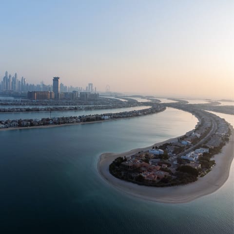 Stay on the Jumeirah Golf Estate, a sixteen-minute drive from Palm Jumeirah
