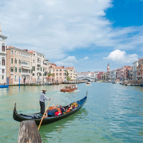 Walk a minute to the nearest Vaporetto stop and take a tour of Venice seated in a gondola