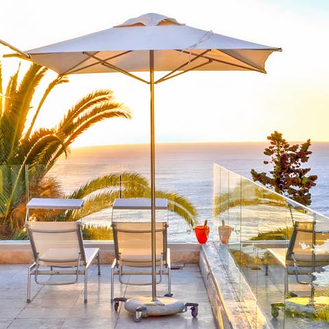 Soak up the sea views as you sip a sundowner on the private balcony