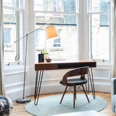 Get some work done at the desk in front of the bay window 