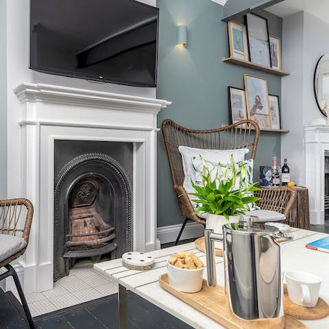 Cosy up by the fire in the elegant living area