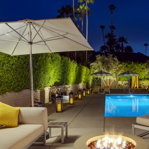 Settle in by the fire for an atmospheric evening poolside evening