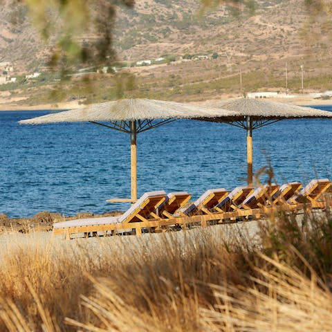 Stroll down to the shared sun loungers to catch some rays at the water's edge