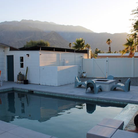 Relax in the private pool and hot tub, admiring the mountain views