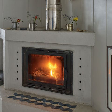 Get a fire roaring in the living room's stove on stormy days