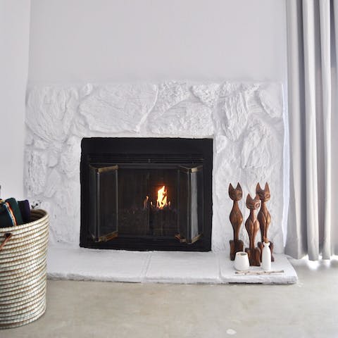 Cosy up by the modern stone fireplace on cooler evenings