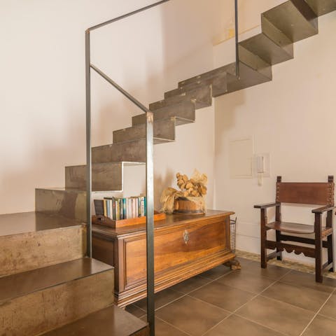 Take yourselves off to bed up the impressive metal staircase