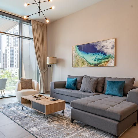 Get cosy in the stylish living room and enjoy the stunning city views outside