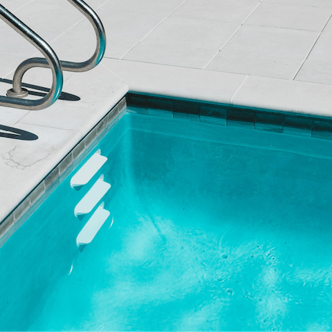 Take a relaxing dip in the communal pool