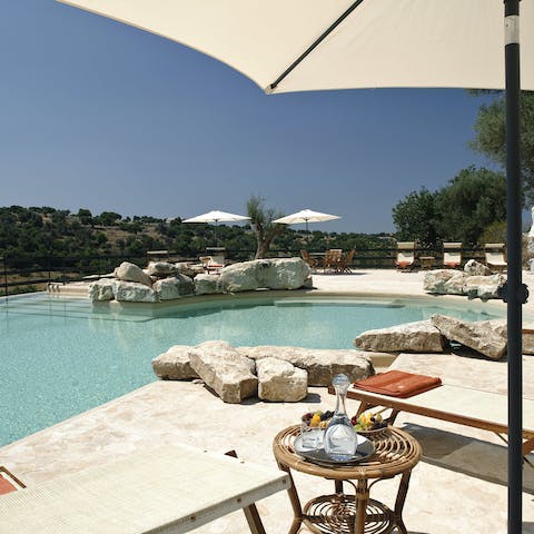 Make lounging beside the shared pool your only firm plan for the day