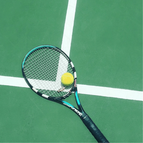 Enjoy a game of tennis on the private court