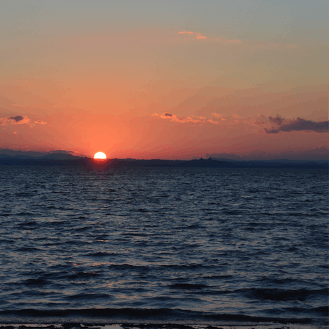 Watch sunset on the tranquil Lake Trasimeno