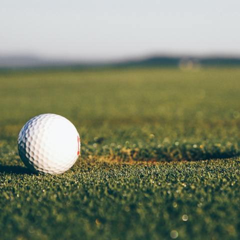Enjoy a few games of golf at the Hills Golf Course