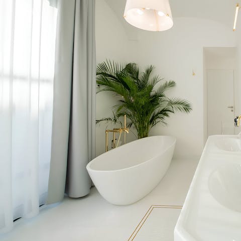 Sink into the luxuries freestanding bathtub after a busy day of exploring