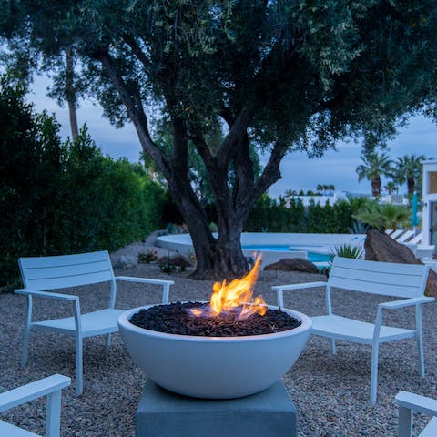 Huddle round the firepit on cooler evenings