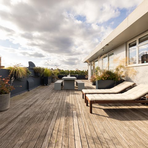 Unwind on the recliners out on your spacious decked terrace