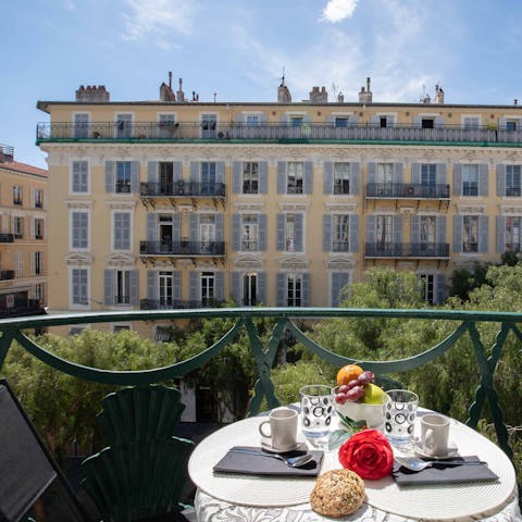 Wake up with the city by having breakfast on the balcony