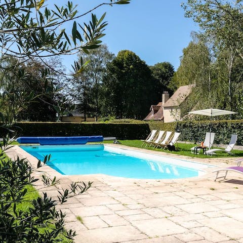 Stay in the countryside where a shared pool is open in the warmer months