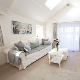 Find the comfiest spot on the couch and unwind after a long day exploring the Somerset countryside