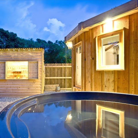 Treat yourself to a relaxing dip in the wood-fired hot tub