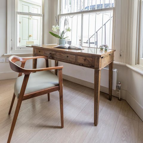 Work from home at this traditional desk in the bay window