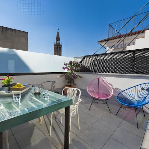 Enjoy alfresco meals on the private terrace overlooking La Giralda