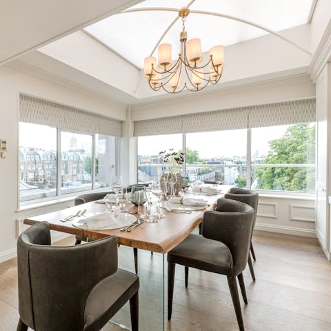 Serve dinner on the smart table surrounded by large windows